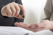 © Roman Motizov - Hands of wife, husband signing decree of divorce, dissolution, canceling marriage, legal separation documents, filing divorce papers or premarital agreement prepared by lawyer. Wedding ring