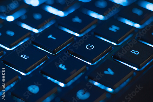 Cuadros en Lienzo Illuminated keyboard closeup. Hi tech concept