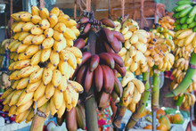  Fruit Market In Sri Lanka - Yellow And Red Bananas On Branches. Natural Simple Organic Food.