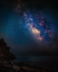Wall Mural - milky way over the seashore. long time exposure night landscape with milky way galaxy above the aege
