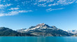 © Rod - Snow-capped mountain peak in Glacier Bay National Park with sky and clouds