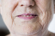 © Rawpixel.com - Portrait of white elderly woman closeup on smiling lips