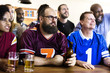 © Rawpixel.com - Frieds cheering sport at bar together