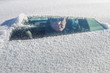© soupstock - Driver in a car looking through a snow covered windshield