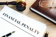 Document with title Financial penalty on a desk.