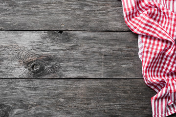 Wall Mural - Red checkered textile on rustic wood. Food background