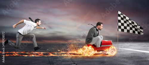 Fotografía Fast businessman with a car wins against the competitors