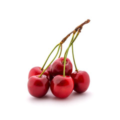 Wall Mural - Photo of red cherries with tails isolated on white background