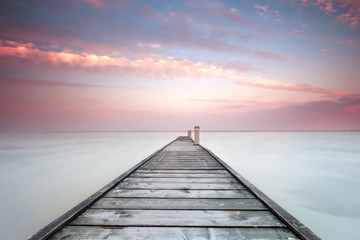 minimalistic landscape with old jetty.long exposure shot.