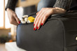 © artursfoto - Woman packing for vacation travel trying to close full suitcase