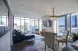 Light filled family room with panoramic view of Seattle