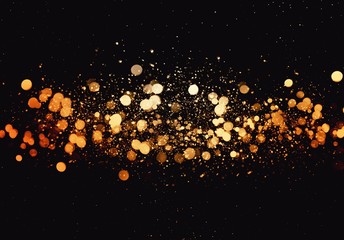 Gold bokeh isolated on black background