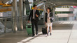 © pixs4u - Two business people walking and drag the baggage along open passage