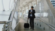 © pixs4u - The Asian businessman walking dragging luggage to exit with hastiness