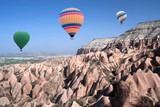 Fototapeta  - Colorful hot air balloons flying over Red valley in Cappadocia, Anatolia, Turkey