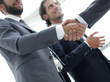 © ASDF - Cropped image of business people shaking hands