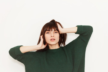 Wall Mural - Beautiful girl posing on white background