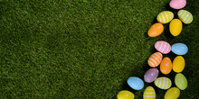 Above Top View Of Multi Colored Painted Easter Egg On Springtime Grown Green Grass