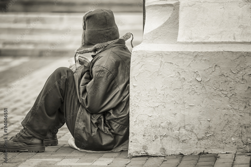 Poor man begging for money on street
