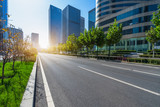 modern asphalt road through modern city skyline