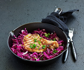 Canvas Print - Pork cutlet on a bone with a salad of red cabbage.