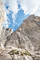 Mountain climber rappelling down cliff