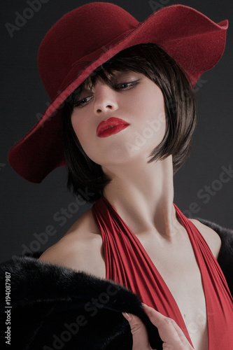Sexy Young Girl With Dark Short Hair In A Red Hat Buy This Stock