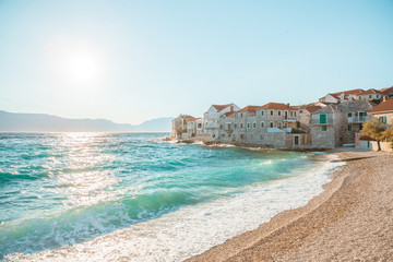 Wall Mural - Panoramic view on a beach of a small town Postira - Croatia, island Brac