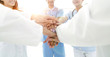 © ASDF - background image of a successful group of doctors on a white bac