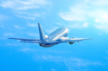 Airplane take off in wet, damp weather, the water flows down the fuselage when climbing blue sky clouds.