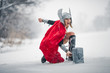 Furious woman in image of Germanic-Scandinavian God of thunder and storm. Cosplay.