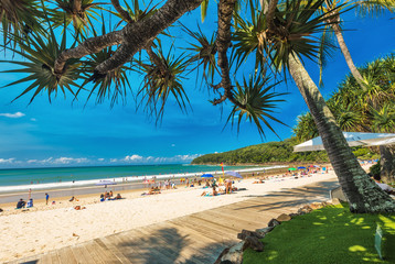 Wall Mural - noosa, australia, feb 17 2018: people enjoying summer at noosa main beach - a famous tourist destina