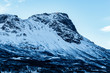 Snow covered mountain peak in a fjord near Narvik, Norway, Scandinavia