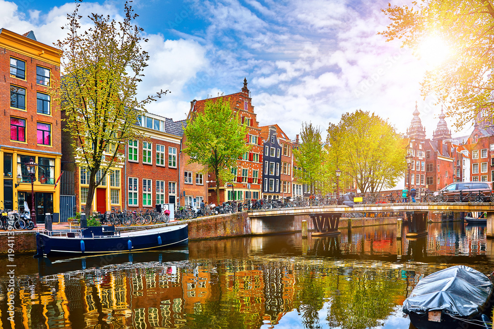 Channel in Amsterdam Netherlands houses river Amstel landmark - obrazy, fototapety, plakaty 