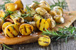 canvas print picture - Vegan grillen: Kleine Rosmarin-Kartoffeln (Drillinge) vom Grill  - Baby potatoes with rosemary from the grill