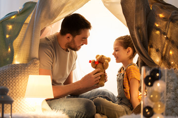 Canvas Print - happy family playing with toy in kids tent at home