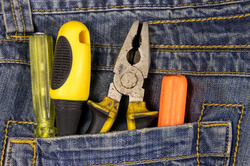 Wall Mural - Pliers and screwdrivers in the jeans pocket