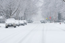 Suburban Street Covered In Heavy Winter Snow