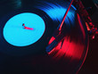 Cinemagraph, retro record vinyl player. Record on turntable. Top view close up. Loop-able Vintage photo of Old Gramophone, playing a music. Neon light