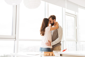 Sticker - Happy young couple embracing while standing together