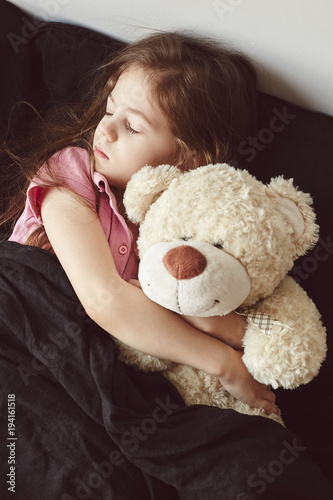 big teddy bear in bedroom