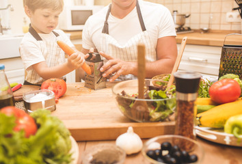 Wall Mural - Father is cooking with his son