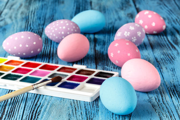 Wall Mural - colorful easter eggs painted on wooden table