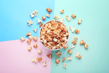 Caramel Popcorn In Bowl On Colorful Background