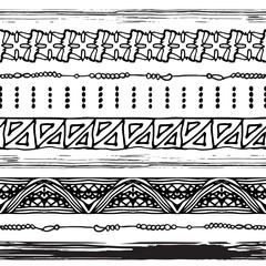 Set of seamless ethnic brushes and borders in black and white. African tribal design. Vector illustration.