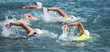© pavel1964 - Group people in wetsuit swimming at triathlon
