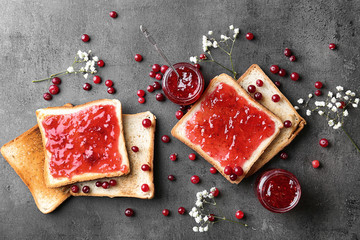 Sticker - Delicious toasts with sweet jam on grey background