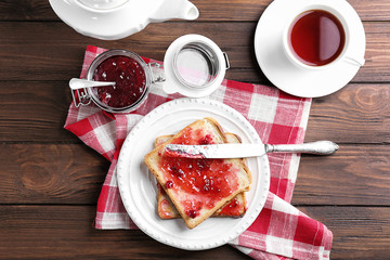 Wall Mural - Delicious toasts with sweet jam on plate