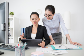 Wall Mural - two beautiful girls business lady working together