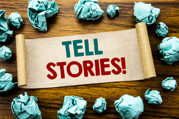 Fototapete - Word, writing Tell Stories. Business concept for Storytelling Telling Story Written on sticky note paper, wooden background with folded yellow paper meaning thinking